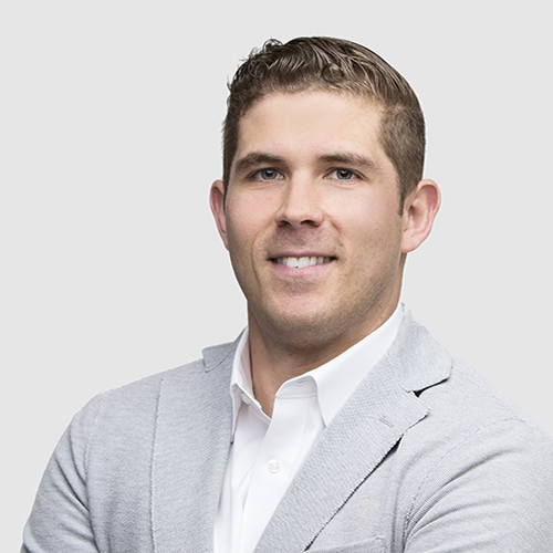 Man in black jacket facing forward
